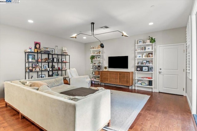 living room with dark hardwood / wood-style flooring