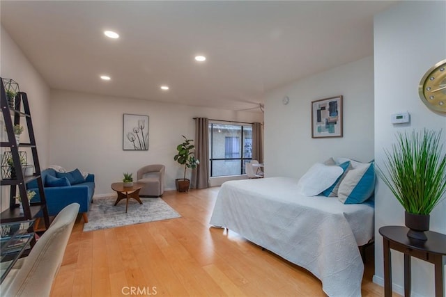 bedroom with hardwood / wood-style floors