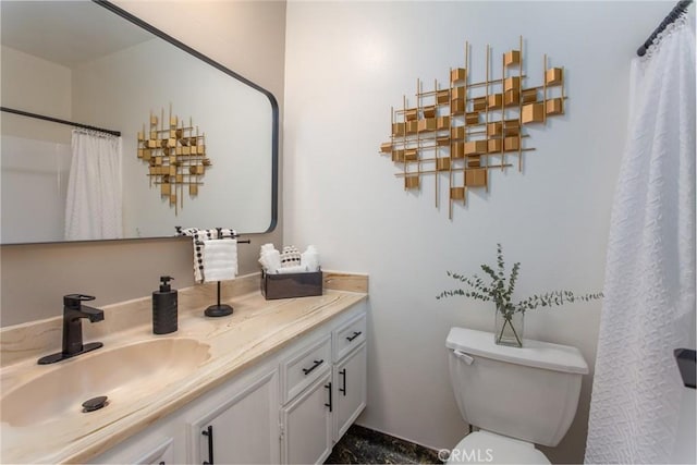 full bathroom with toilet and vanity