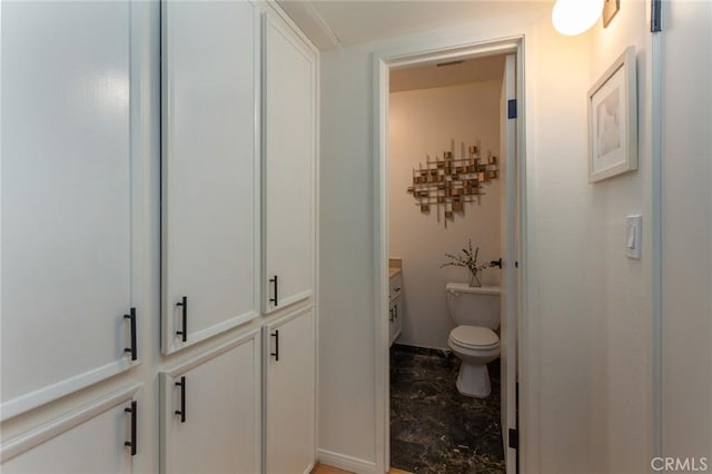 bathroom with vanity and toilet