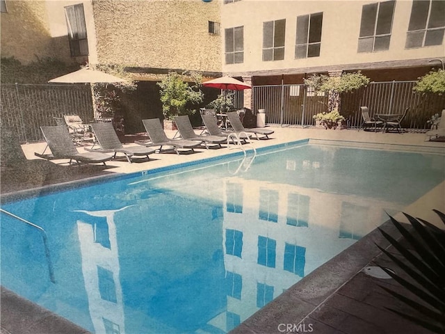 view of pool featuring a patio