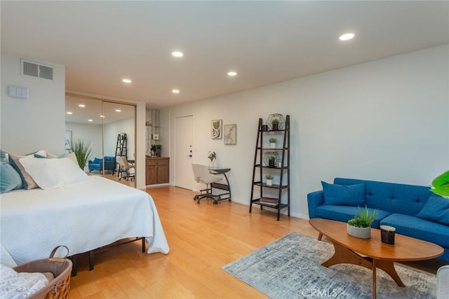 bedroom with hardwood / wood-style flooring