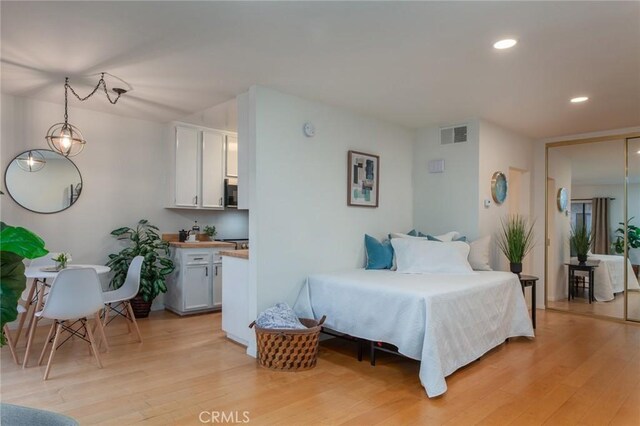 bedroom featuring light hardwood / wood-style floors