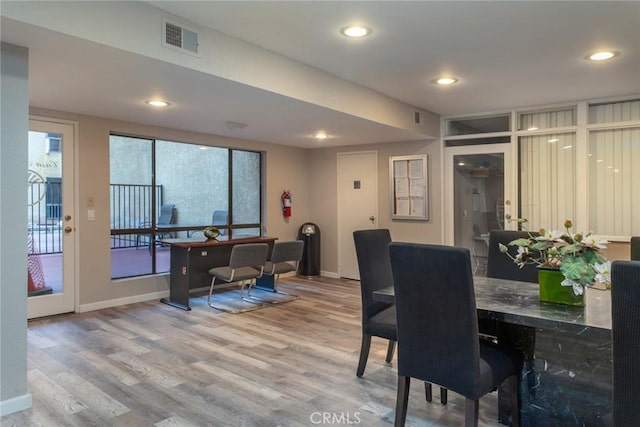 dining area with light hardwood / wood-style flooring