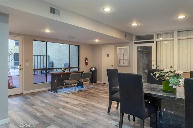 dining room featuring visible vents, recessed lighting, and wood finished floors