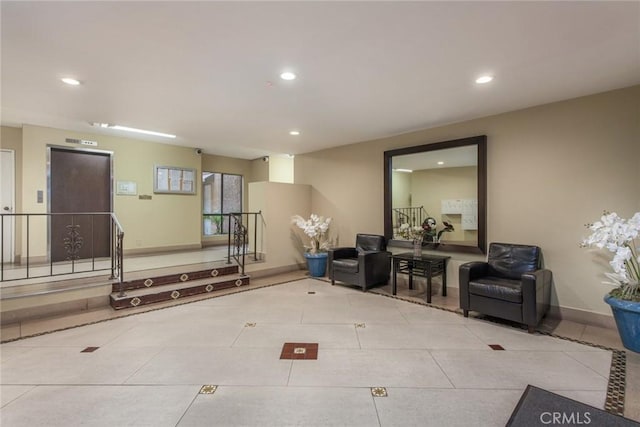 interior space with tile patterned floors, recessed lighting, and baseboards