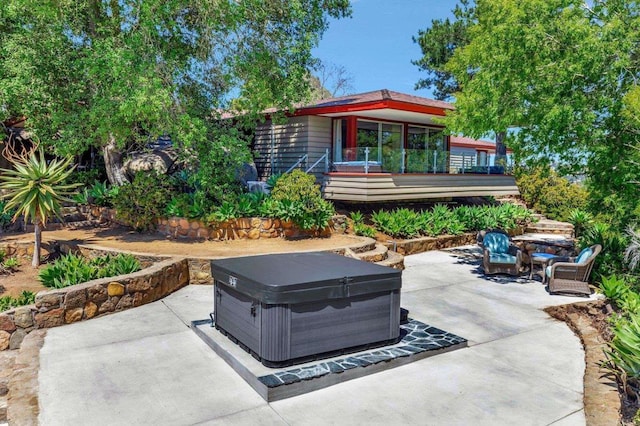 view of patio / terrace featuring a hot tub