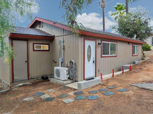 view of front of home with ac unit