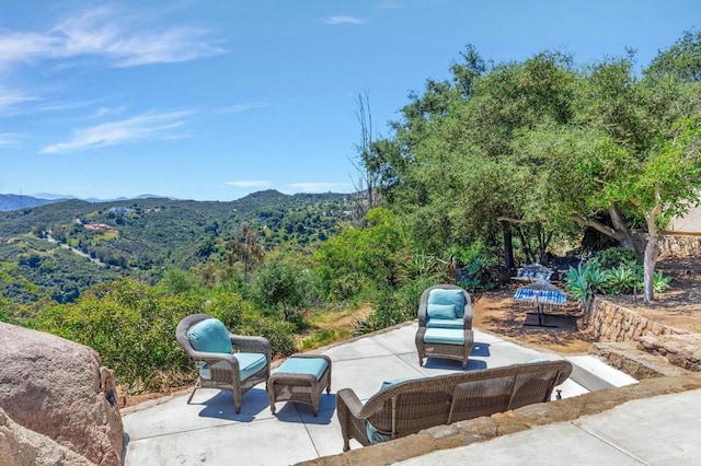 view of patio / terrace featuring a mountain view