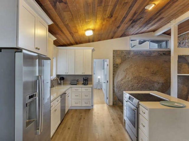 kitchen with light wood-type flooring, stainless steel appliances, light countertops, wooden ceiling, and lofted ceiling
