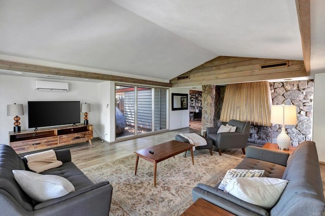 living room featuring a wall mounted air conditioner, lofted ceiling, wood finished floors, and visible vents