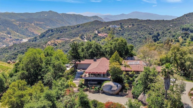 birds eye view of property with a mountain view