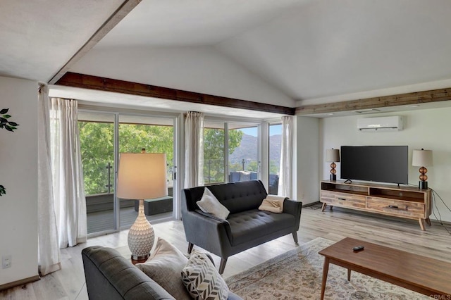 living room with vaulted ceiling, light wood-type flooring, and a wall unit AC