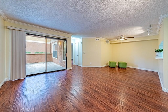 spare room with crown molding, wood-type flooring, a textured ceiling, and ceiling fan