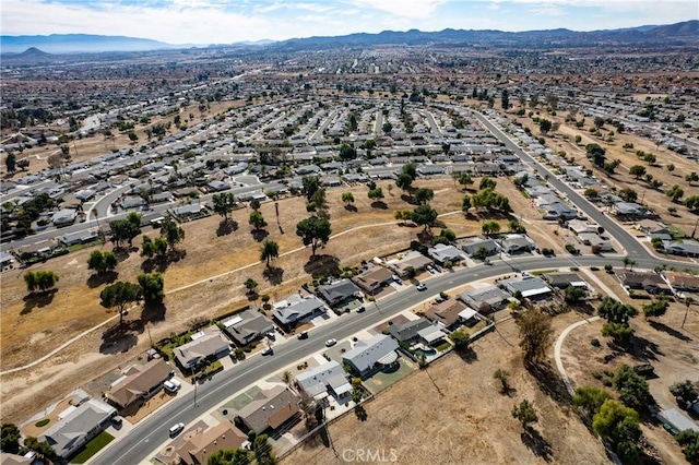 birds eye view of property with a mountain view