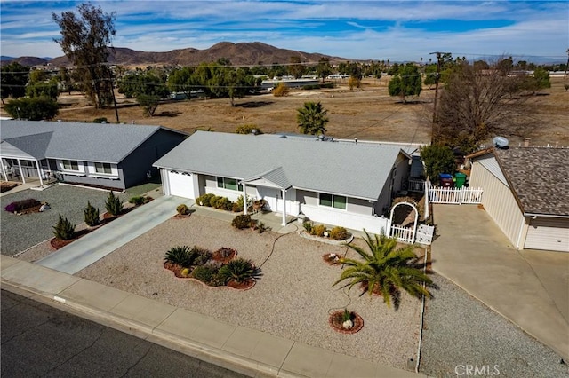 birds eye view of property with a mountain view