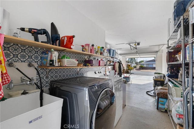 laundry room featuring sink and washer and dryer