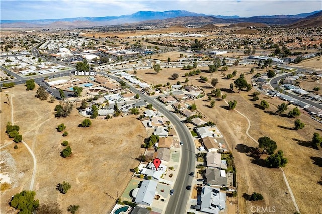 birds eye view of property featuring a mountain view