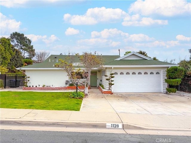 ranch-style house featuring a garage and a front lawn