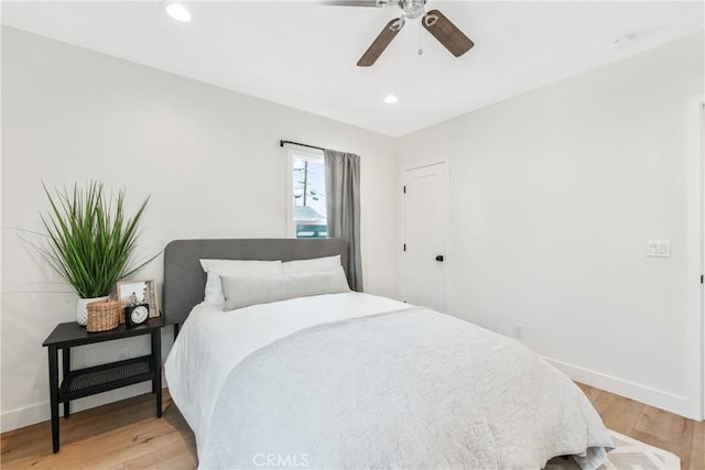 bedroom featuring ceiling fan and light hardwood / wood-style flooring