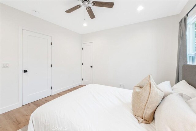 bedroom featuring ceiling fan and light hardwood / wood-style flooring