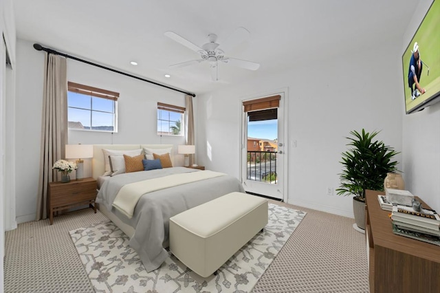 carpeted bedroom featuring ceiling fan and access to outside