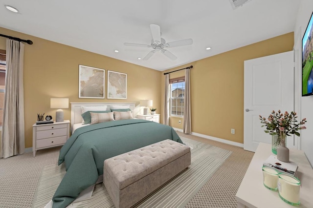 bedroom with ceiling fan and light colored carpet