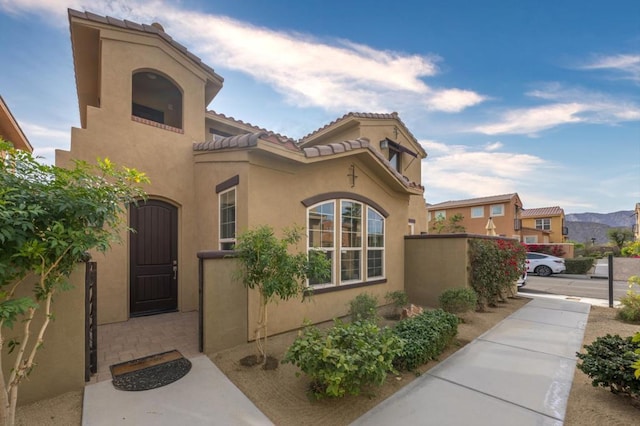 view of side of home featuring a mountain view