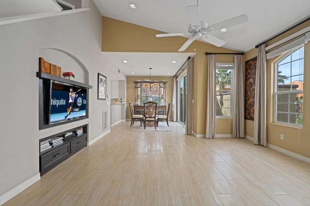 unfurnished living room with lofted ceiling and ceiling fan