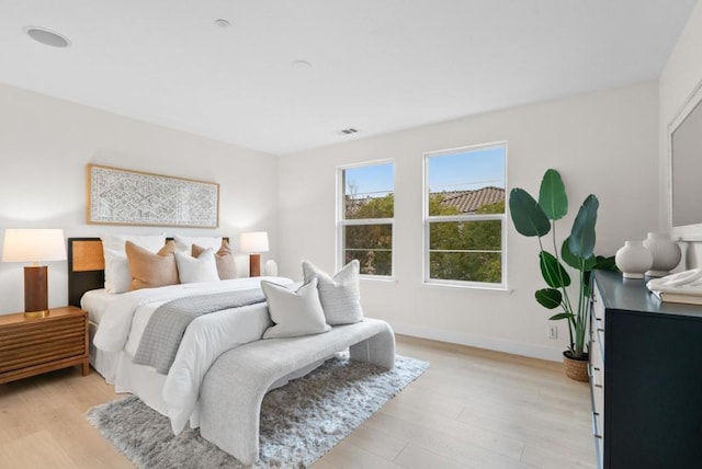 bedroom with light hardwood / wood-style floors