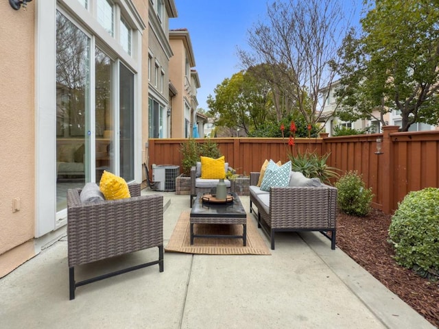 view of patio with outdoor lounge area and cooling unit