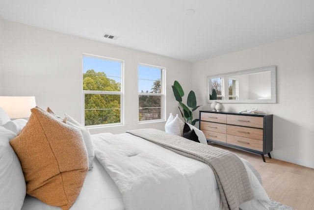 bedroom with light wood-type flooring