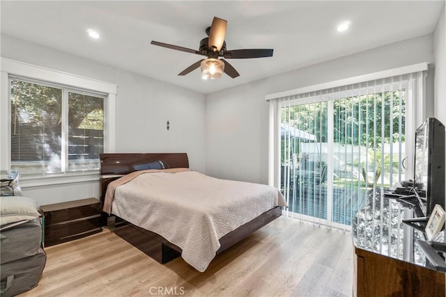 bedroom with ceiling fan, access to exterior, and light wood-type flooring