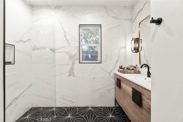 bathroom featuring vanity and a tile shower