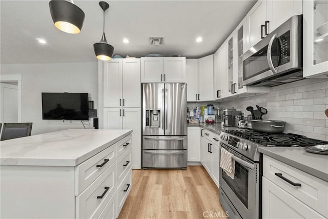 kitchen with stainless steel appliances and white cabinets