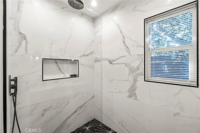 bathroom featuring tiled shower