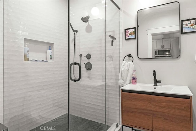 bathroom with vanity and an enclosed shower