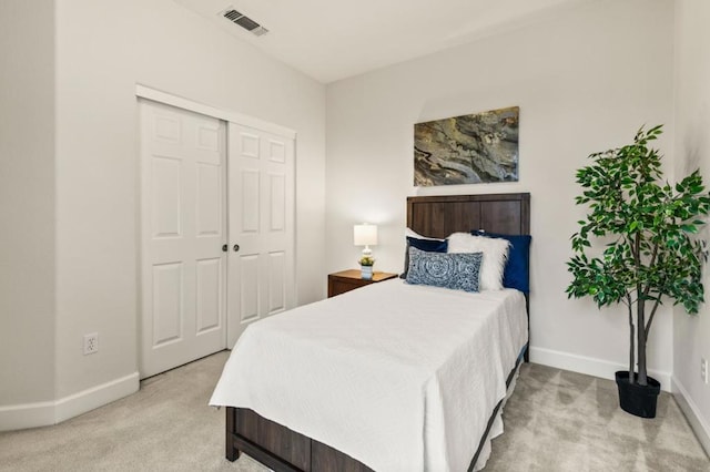 carpeted bedroom featuring a closet