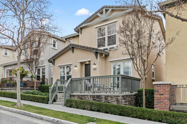 view of front of house with a wooden deck