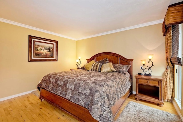 bedroom with ornamental molding and light hardwood / wood-style floors