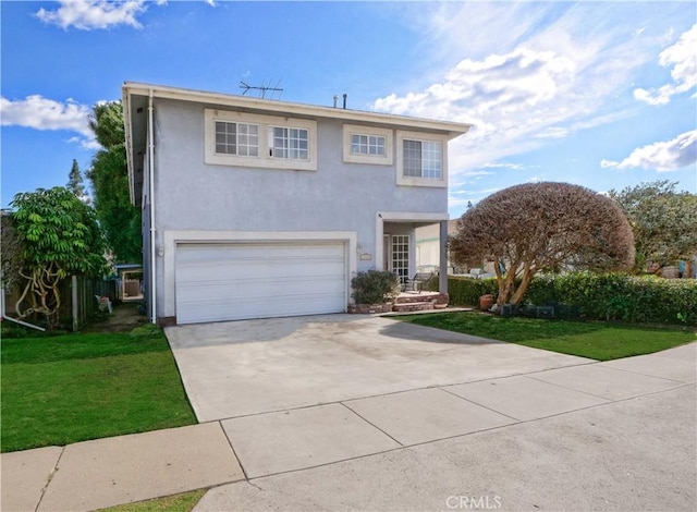 front of property with a front lawn and a garage