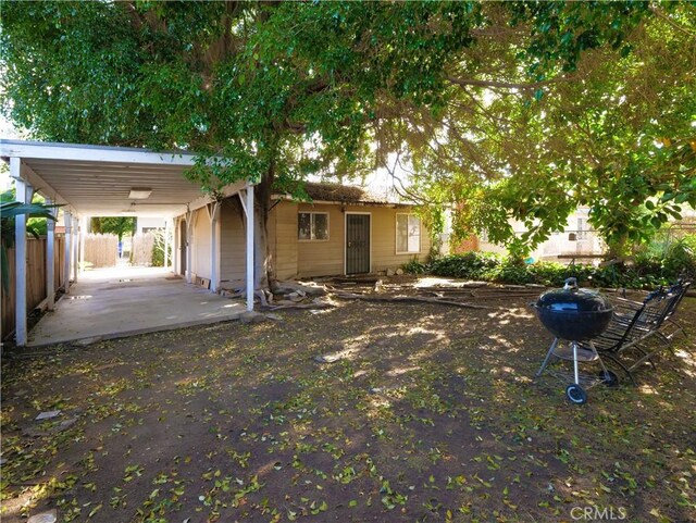 view of front of property featuring a carport