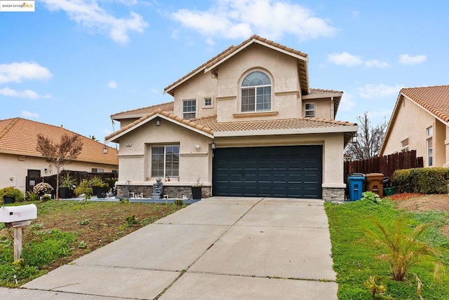 mediterranean / spanish-style house featuring a garage