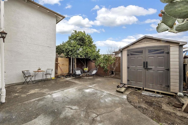 view of patio with a shed