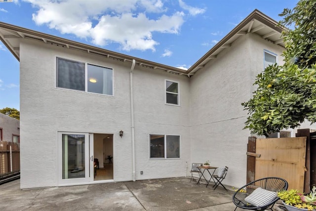 rear view of house with a patio