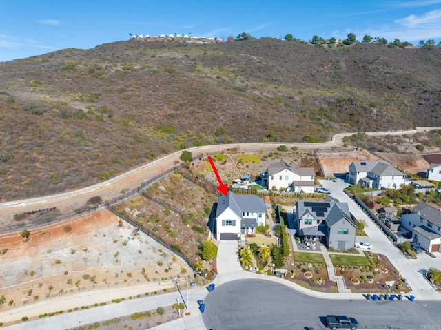 drone / aerial view featuring a mountain view