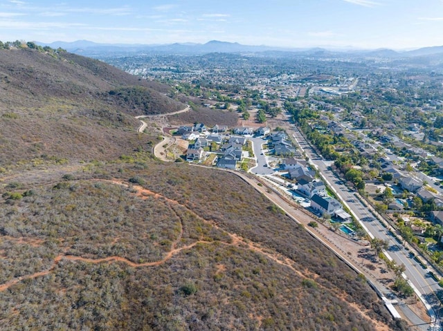 birds eye view of property featuring a mountain view