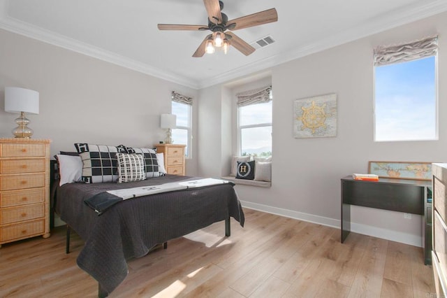 bedroom featuring ornamental molding, light hardwood / wood-style floors, and ceiling fan