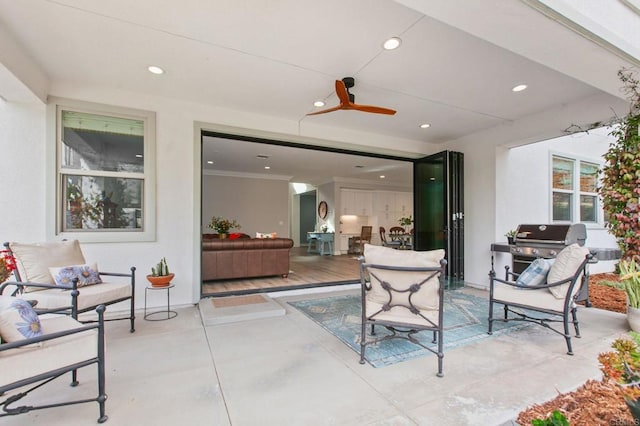 view of patio featuring ceiling fan and area for grilling