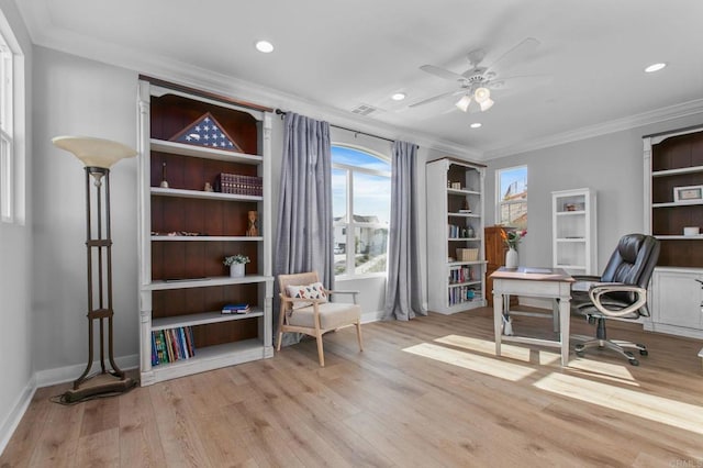 office area with crown molding, ceiling fan, and light hardwood / wood-style flooring